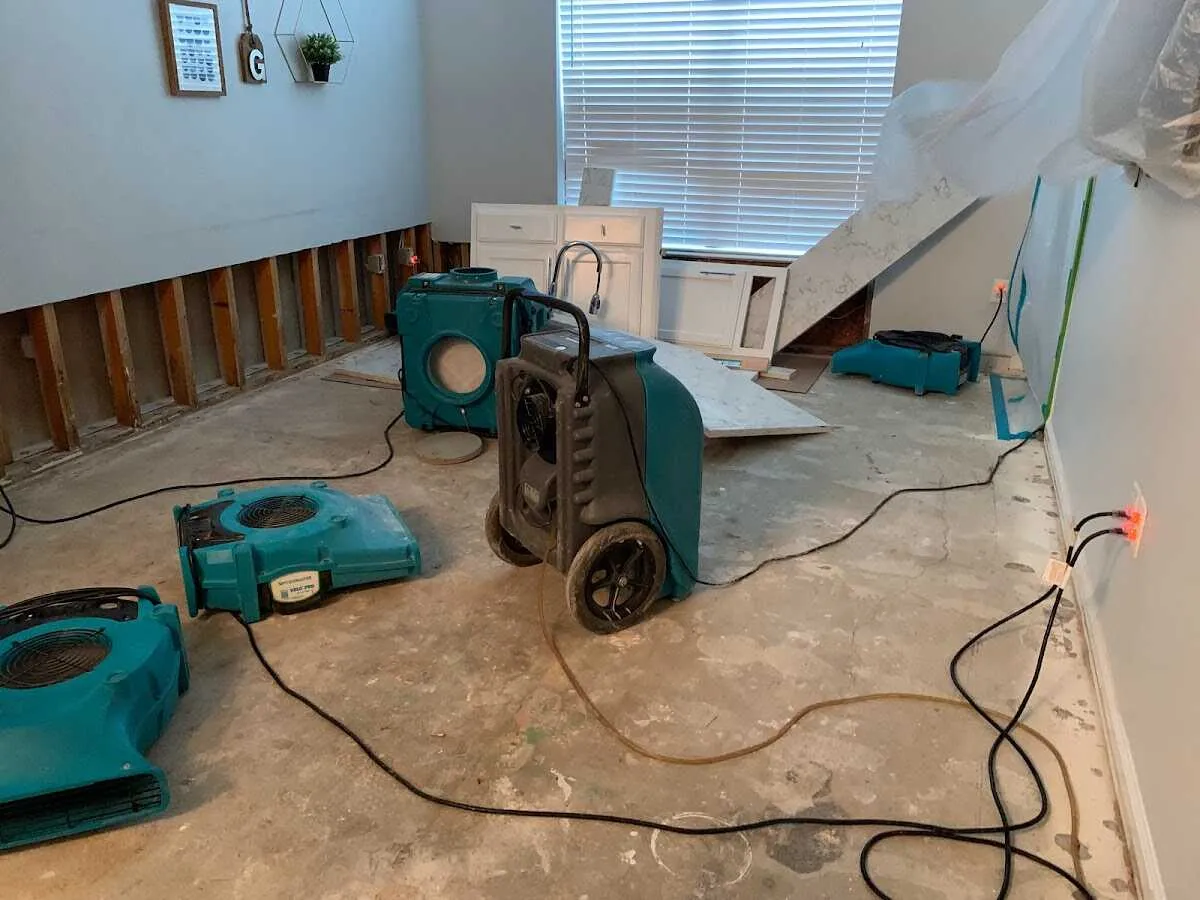 Dehumidifier in flood-cut room for Water Damage Restoration in Sharon