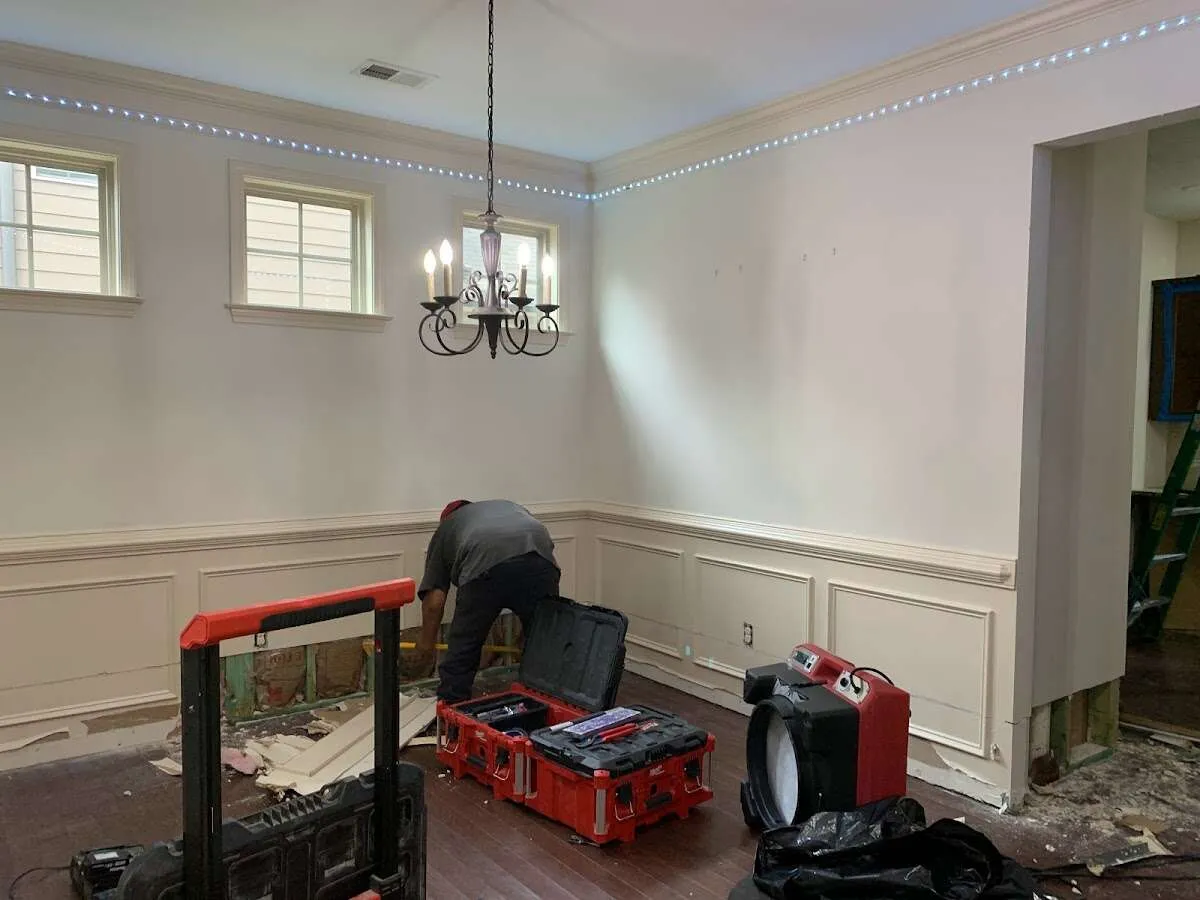 Restoration technician with professional equipment in Sharon